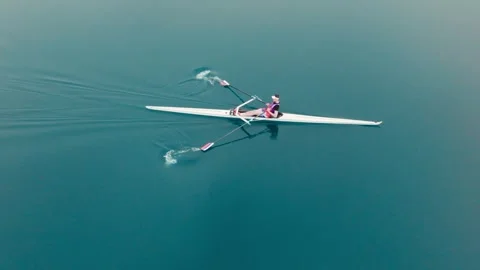 Rowing Top view of professional rower in racing boat, symbol of strength Stock Footage 324728233