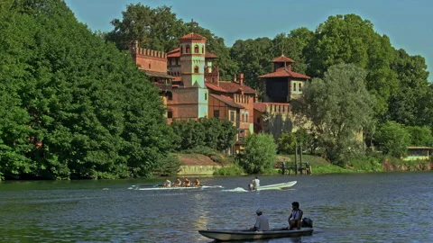 Rowing training with the team on the canoe and the coach on the motor boat Stock Footage 207013546