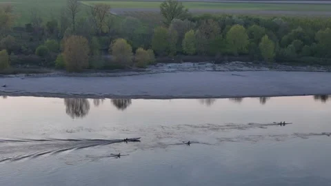 Rowing training—Po River scullers with master-coach in motorboat, teamwork Stock Footage 319834486