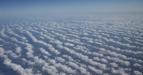 Rows of Altocumulus Clouds Scrolling By During Flgiht Stock Footage 222292786