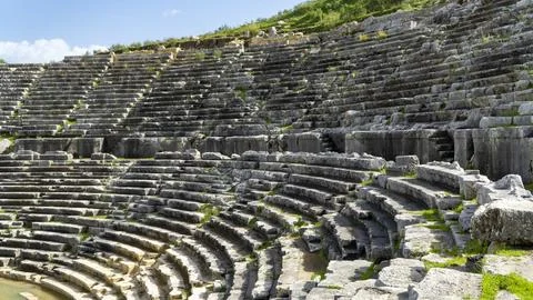 Rows of ancient stone seating in the Hellenistic theater at Letoon Sacred A.. Foto stock