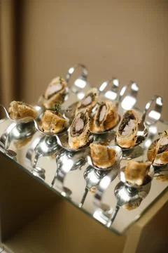 Rows of appetizers and starters on the wedding table Stock Photos