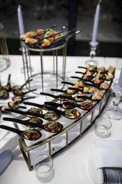 Rows of appetizers and starters on the wedding table Stock Photos
