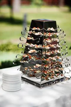 Rows of appetizers and starters on the wedding table Stock Photos