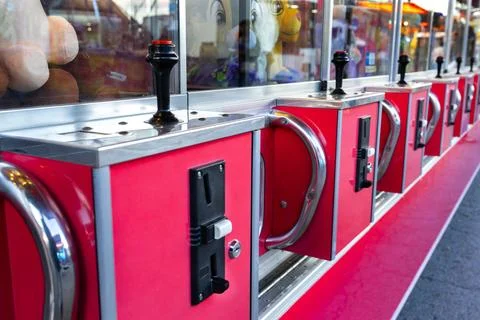Rows of arcade game control handles forming a repetitive pattern at a fairg.. Stock Photos