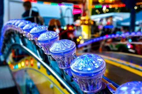 Rows of arcade game control handles forming a repetitive pattern at a fairg.. Stock Photos