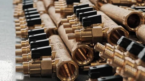 Rows of assembled brass manifolds with black valves. Water supply systems Stock Footage 329262626