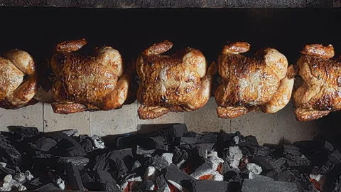 Rows of Authentic Peruvian Rotisserie Chicken Roasting on a Spit Stock Footage 339077969