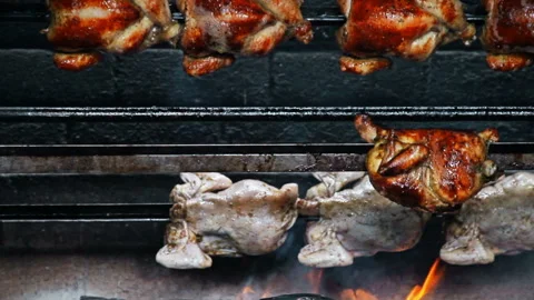 Rows of Authentic Peruvian Rotisserie Chicken Roasting on a Spit Stock Footage 341440832