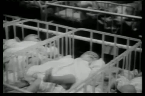 Rows of babies in cribs in hospital Stock Footage 11353065