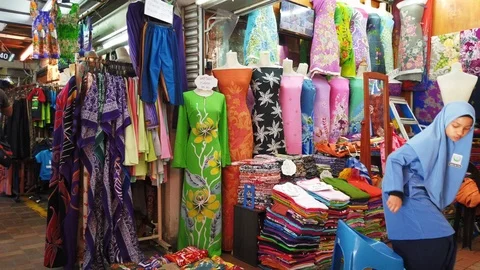 Rows of batik cloth on display at a local shopping outlet in Malaysia. Stock Footage 106069914