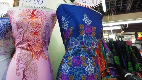 Rows of batik cloth on display at a local shopping outlet in Malaysia. Видео 106070343