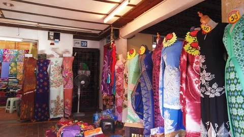 Rows of batik cloth on display at a shopping outlet in Terengganu, Malaysia. Stock Footage 106069377