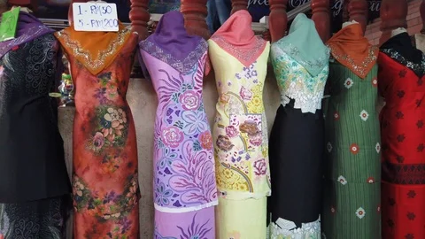 Rows of batik cloth on display at a shopping outlet in Terengganu, Malaysia. Stock Footage 106070670