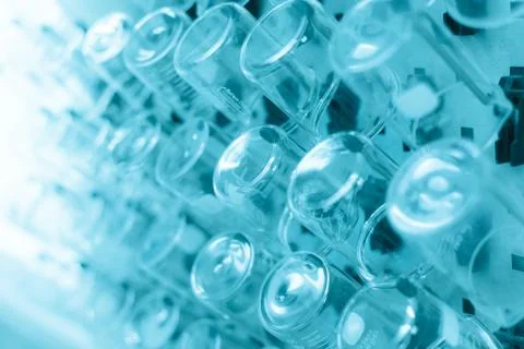Rows of beaker on a drying rack in a chemistry lab. Stock Photos