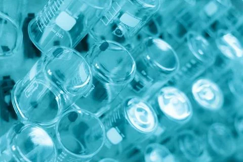 Rows of beaker on a drying rack in a chemistry lab. Stock Photos
