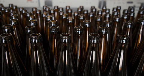 Rows of beer bottles in the factory. Empty brown bottles in a line Stock Footage 108276289