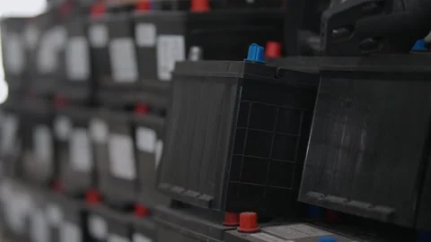 Rows of black batteries sit stacked tightly Stock Footage 339546462