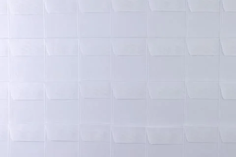 Rows of blank white envelopes on desk in office, short focus, toning Stock Photos