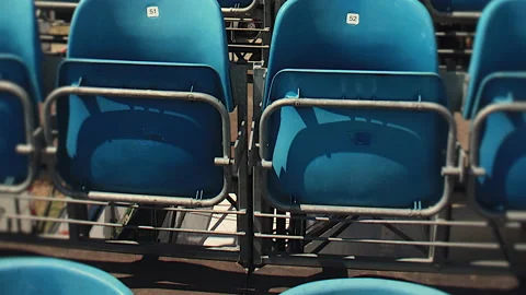 Rows Of Blue Plastic Seats At Empty Stadium Tribune Stock Footage 137328621