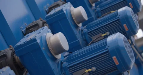 Rows of blue powerful industrial motors in the processing line of a new factory Stock Footage 162017207
