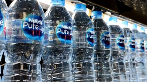 Rows of Bottled Water Neatly Arranged on Supermarket Shelves Stock Footage 305525873