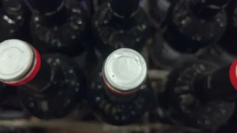 Rows of bottles of red and white wine stand on pallets in a liquor store or Stock Footage 237087850