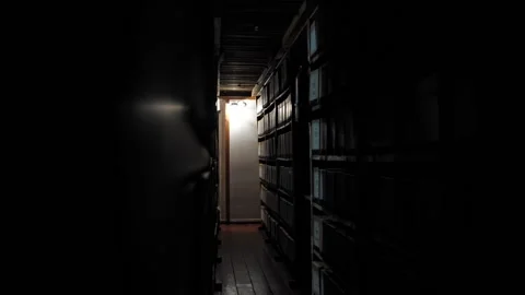 Rows with boxes, documents and books in an old archive or library. Stock-Footage 221349069