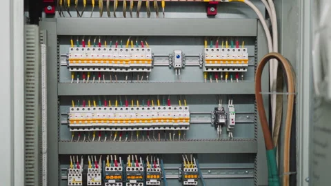 Rows of breakers and colorful wires on open circuit board Stock Footage 243302729