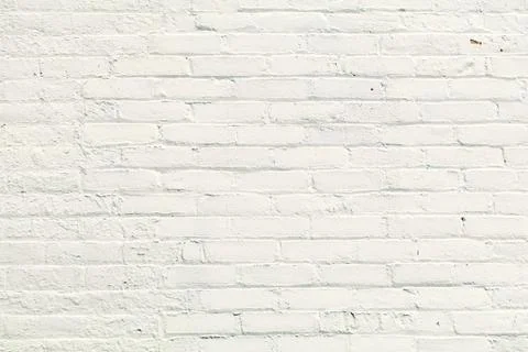 Rows of bricks painted white with sunlight Stock Photos