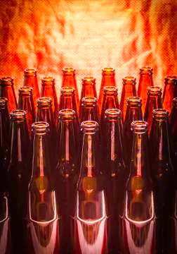 Rows of brown color empty bottles beer Stock Photos