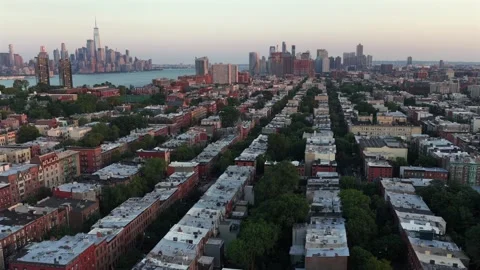 Rows of brownstone rooftops stretch through residential Hoboken, New Jersey Stock Footage 340969296