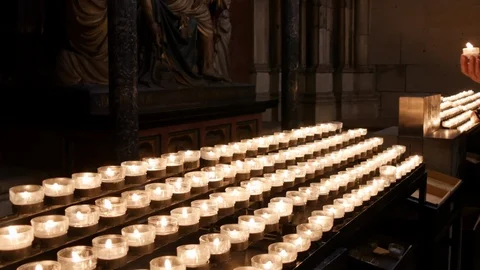 Rows of burning candles / tea lights in Catholic Cathedral, Cologne, Germany Stock Footage 95095689