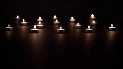 Rows of Candles on Black Stock Footage 72497044