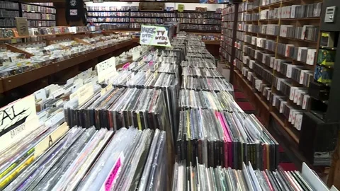 Rows of CD, DVD and record vinyls at used music store Stock Footage 334835007