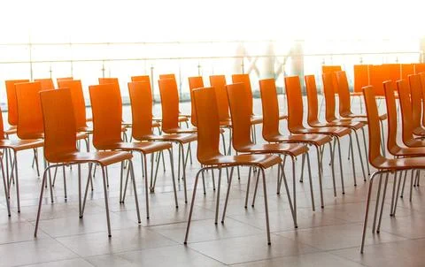 Rows of chairs - meeting background. Selective focus Stock Photos