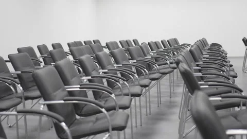 Rows of chairs with shiny armrests stand in meeting hall Stock Footage 318736339