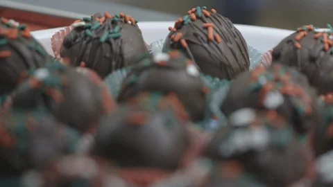 Rows of chocolate truffles in display case Stock Footage 104868720