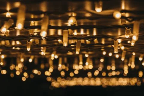 Rows of Christmas lights at night, selective focus. Stock-Fotos