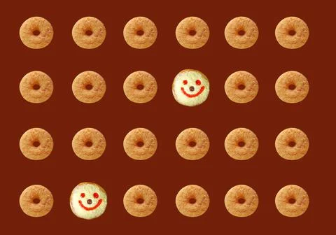 Rows of Cinnamon Doughnuts with Smiling Face Coconut Flakes Jelly Donuts Pattern Stockfoto's