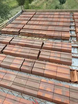 Rows of Clay Floor Blocks Crossed by Reinforcing Steel Bars Stock Photos