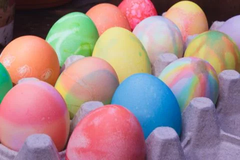 Rows of colored easter eggs in an egg carton Stock Photos
