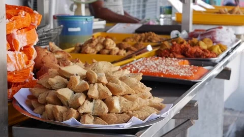 Rows of colorful Indian sweets such as jalebi gulab jamun and ladoo displayed on Stock Footage 319814275