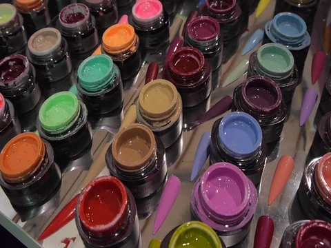 Rows of colorful test specimens of nail polish. Closeup. Shallow depth of field Stock Footage 73397868
