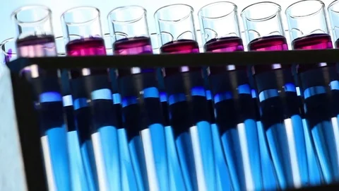 The rows of colorful vials backlight dolly shot Stock Footage 77209139