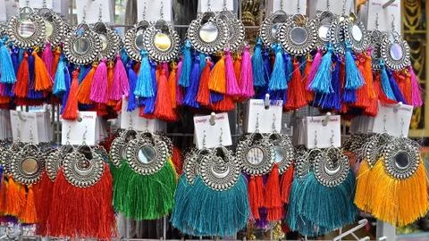 Rows of colourful earrings Stock Photos