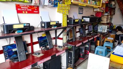 Rows of computers and printers in internet cafes and printing shops Stock Photos