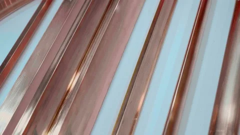 Rows of copper blanks of various sizes and profiles glisten in the light Video stock 187486161