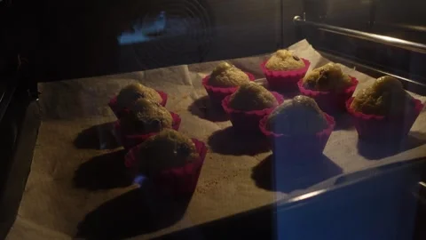Rows of cupcakes baking in the oven Stock Footage 292403134