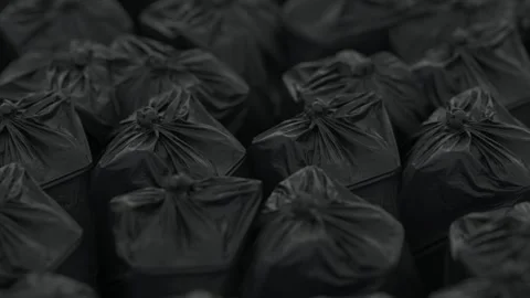 Rows of densely packed black trash bags move slowly in front of the camera Stock-Footage 149768848